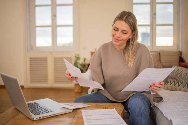 istock Mature woman going through paperwork 1479531946