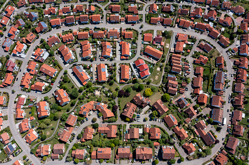 Aerial view of red roof homes in residential neighborhood.