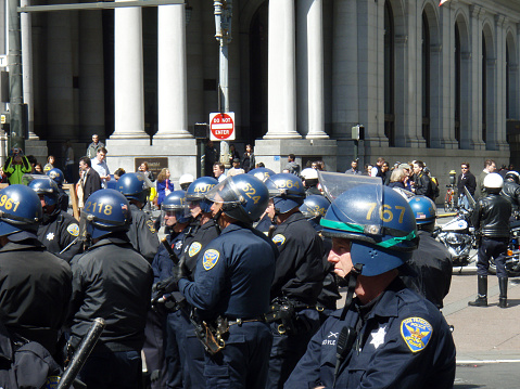 Back of a Police Officer Overlooking an Event