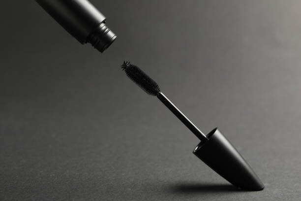 istock Black mascara with wand on grey background 1479534938