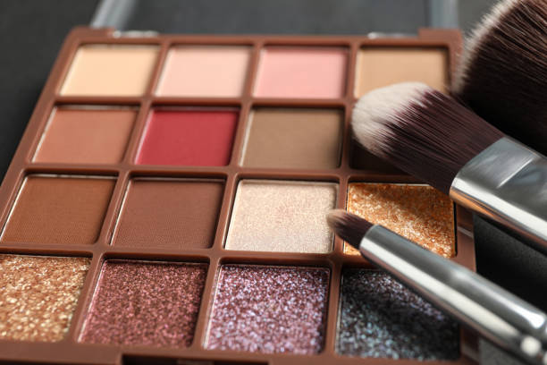 istock Colorful eyeshadow palette with brushes, closeup view 1479535151