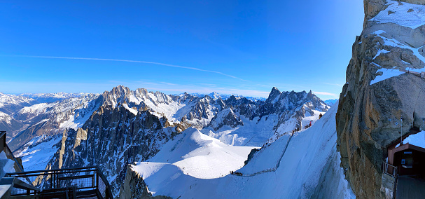 The Aiguille du Midi is a 3,842-metre-tall (12,605 ft) mountain in the Mont Blanc massif within the French Alps. It is a popular tourist destination and can be directly accessed by cable car from Chamonix that takes visitors close to Mont Blanc.
