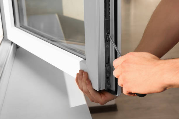 istock Worker adjusting installed window with screwdriver indoors, closeup 1479537622
