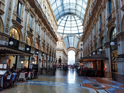 Interior view of the Galleria Vittorio Emanuele II in Piazza del Duomo with its luxury shops and its glass ceiling. Milano