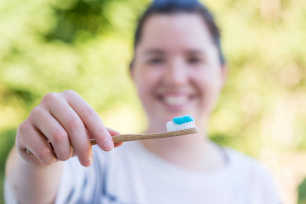istock Brushing my Teeth with a Bamboo Toothbrush 1479544614