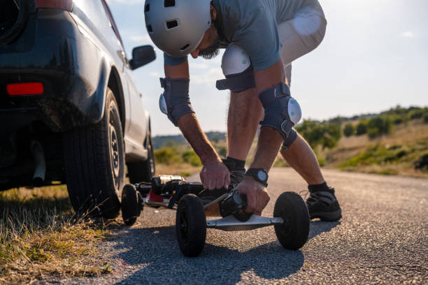istock Man tries his electric mountainboard at sunset. 1479551665