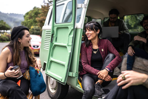 istock Friends talking on a road trip in a retro mini van 1479551683