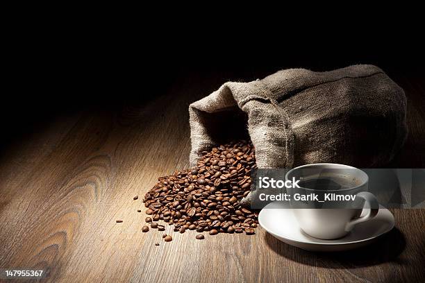 Coffee Cup With Burlap Sack Of Roasted Beans On Rustic Stock Photo - Download Image Now