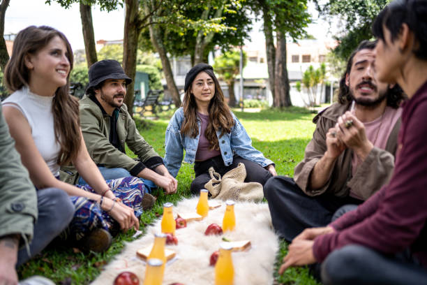 istock Friends talking during a picnic at public park 1479554160