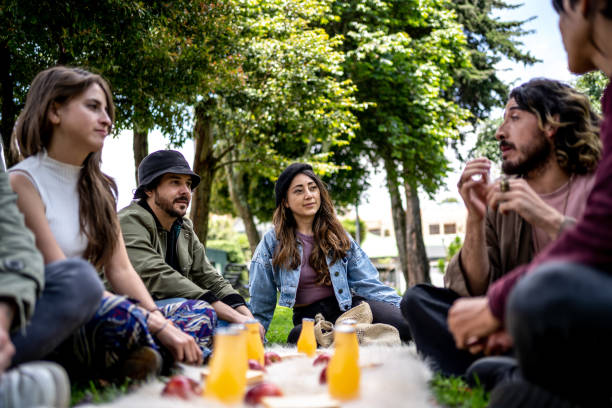 istock Friends talking during a picnic at public park 1479554168