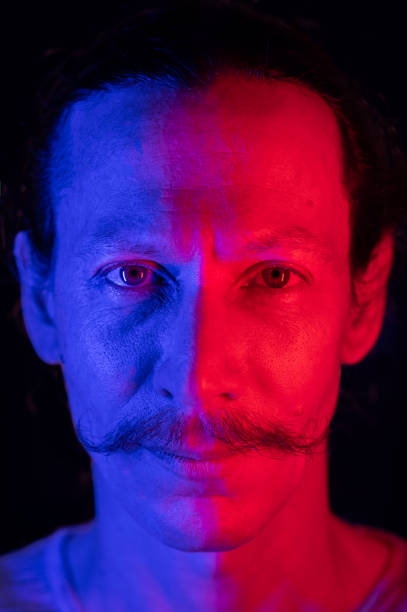 istock Modern red and blue light portrait of a young man 1479554936