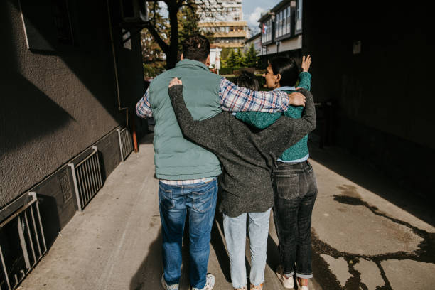 istock Happy friends hugging 1479560812