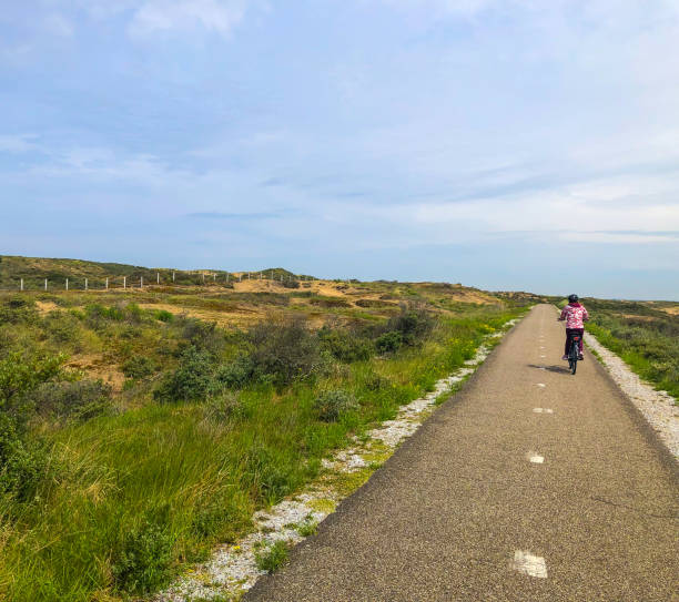 istock Bicycle Tour through Dune Landscape 1479569745