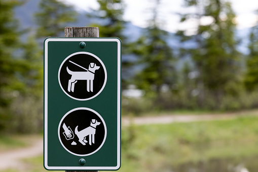 Dogs Must Be Kept On A Leash and Clean up your dog waste warning Sign, Ontario, Canada