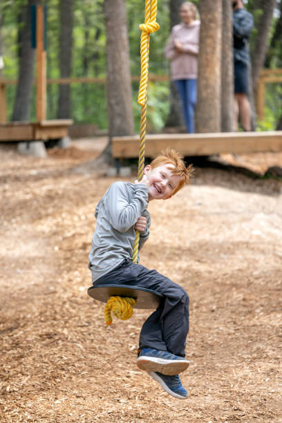 istock Cute Redhead Boy Havinf Fun at the Park 1479574103