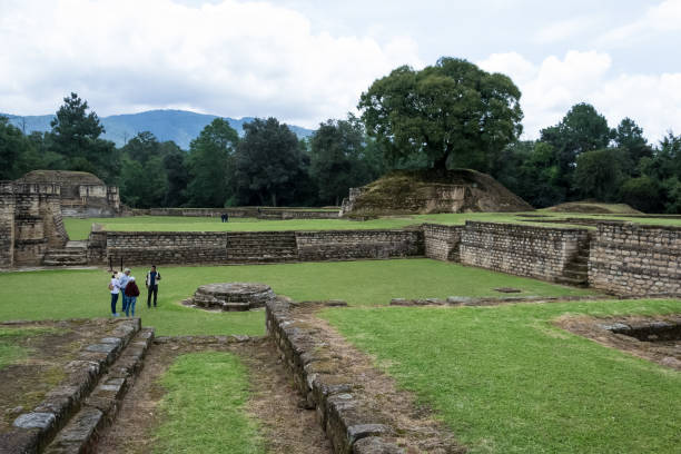 Ancient ruins of Iximche, a significant Pre-Columbian Mesoamerican archaeological site situated in the picturesque western highlands of Guatemala. Once the capital of the Late Postclassic Kaqchikel Maya kingdom, which thrived between 1470 and 1524, Iximche is steeped in rich history and culture. The intricate stonework and architectural details of the ruins are a testament to the impressive engineering skills of the Maya civilization, and the serene natural surroundings make for a breathtaking backdrop. This photo is perfect for anyone seeking to capture the beauty and wonder of this awe-inspiring historical site.