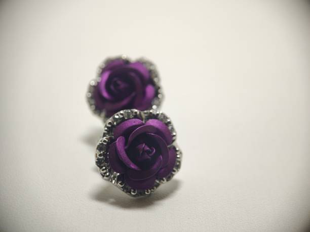 homemade ideas, macro photo of luxurious, dark purple, textured, petal-shaped, flower earrings, very pretty photographed on a white background,