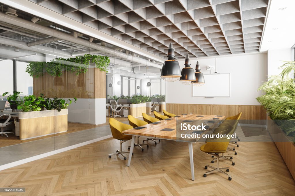 Eco-Friendly Open Plan Modern Office Interior With Meeting Room. Wooden Meeting Table, Yellow Chairs, Plants And Parquet Floor Office Stock Photo