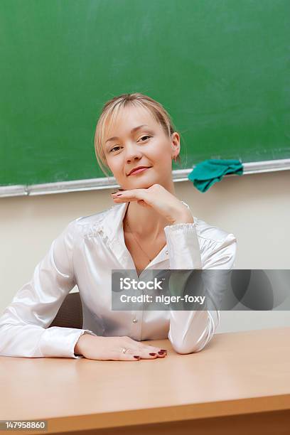 Teacher In Classroom Stock Photo - Download Image Now - Adult, Chalkboard - Visual Aid, Classroom