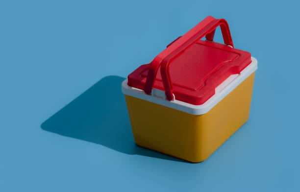 istock Red and yellow plastic cool box on pink background,Handheld refrigerator 1479595361