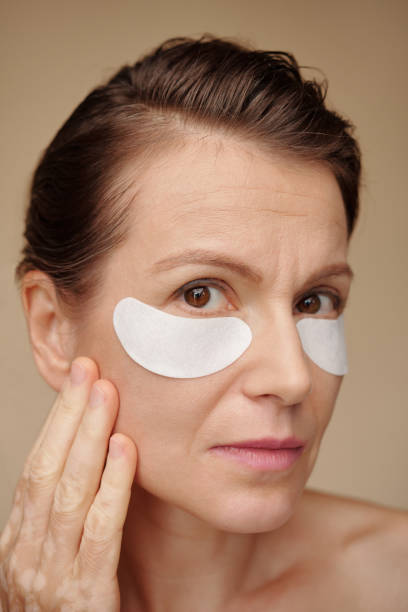 istock Woman Applying Patches under Eyes 1479598040