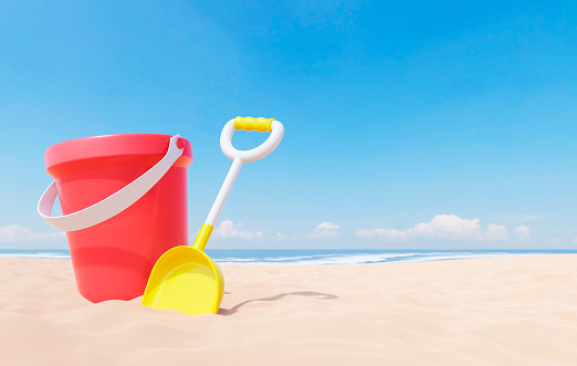 3D render illustration of yellow shovel and red bucket on sandy beach