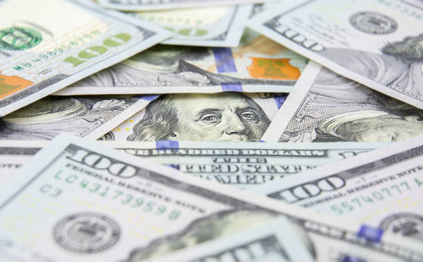 istock Heap of one hundred dollar bills 1479602362