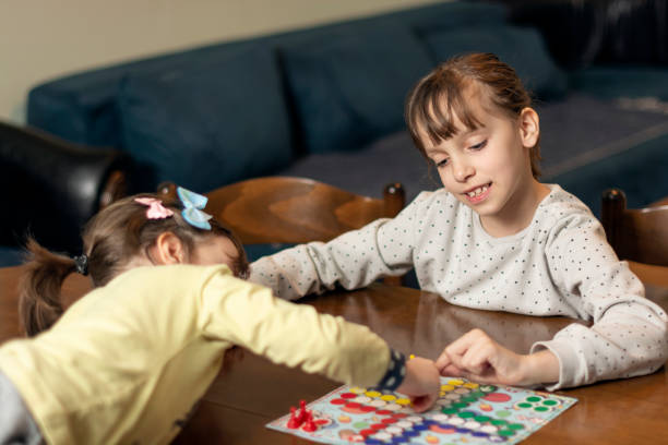 istock Children playing board game at home 1479606739