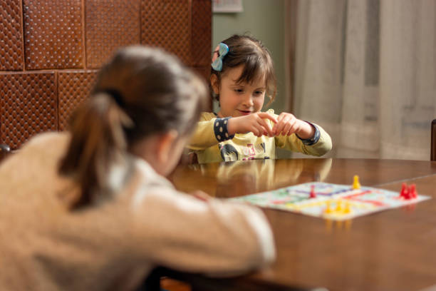 istock Kids playing board game at home 1479607127