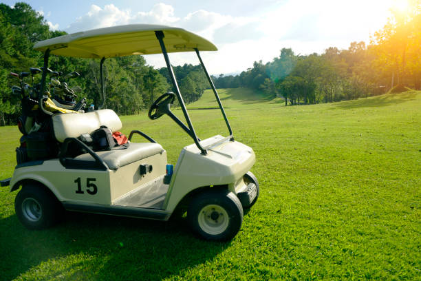 istock Golfcar in beautiful golf course in the evening golf course with sunshine 1479619332