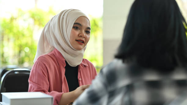 istock Asian muslim student working on assignment and preparing for exams with her classmates. Youth lifestyle and education concept. 1479621855