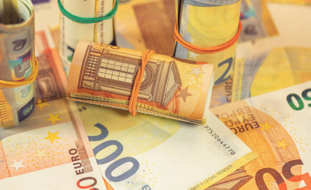 istock Background of twisted and scattered Euro banknotes 1479623124