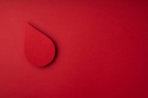 istock World donor day concept with paper red drop on red background 1479624322