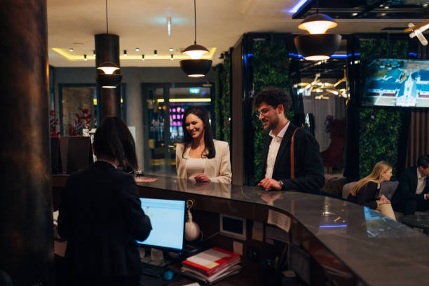 istock Two entrepreneurs approach the hotel reception to pick up their reservation 1479624691