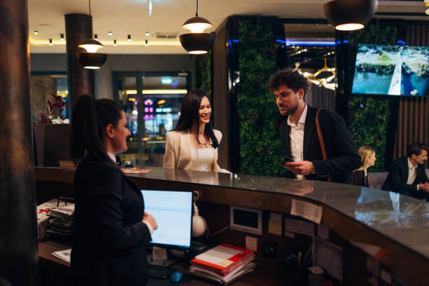 istock Two business people check in at the hotel reception 1479624735
