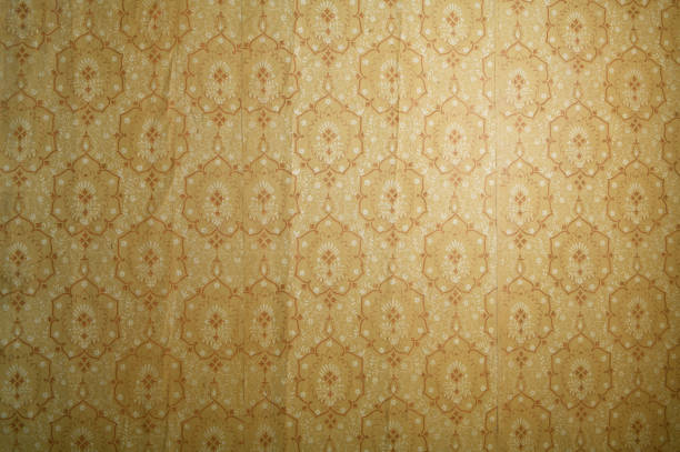 istock Old wallpaper on the wall. Old wallpaper for texture or background. 1479627288