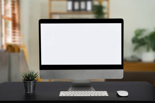 istock Workspace computer, tablet, pencil and coffee cup with plant pot on office table. 1479634856
