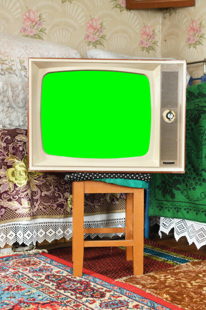 istock An old vintage TV with a green screen in a rustic interior. 1479637806