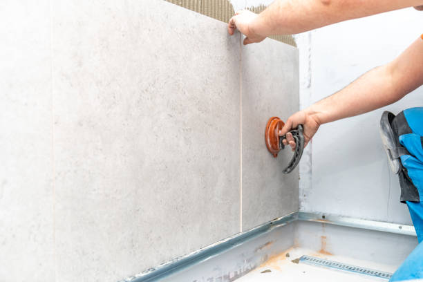 istock craftsman tiling the room with large format tiling 1479638882