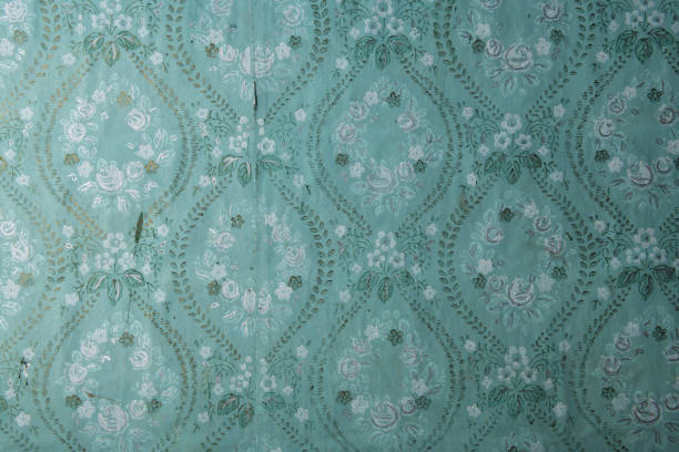 istock Old wallpaper on the wall. Old wallpaper for texture or background. 1479639207