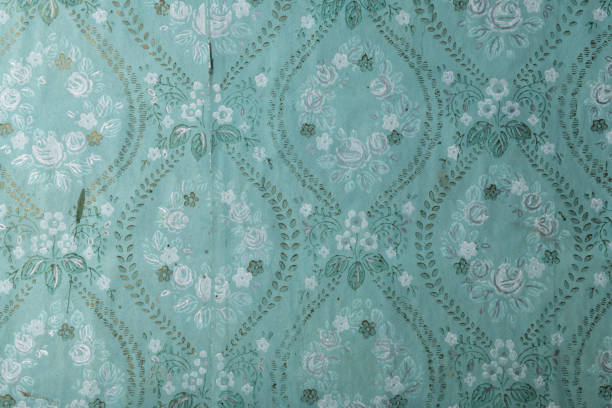 istock Old wallpaper on the wall. Old wallpaper for texture or background. 1479639237