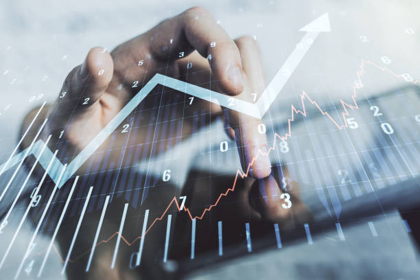istock Abstract creative financial graph with upward arrow and finger clicks on a digital tablet on background, financial and trading concept. Multiexposure 1479639950