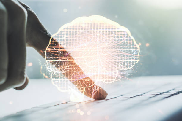 istock Creative artificial Intelligence concept with human brain hologram and hands typing on laptop on background. Multiexposure 1479640081