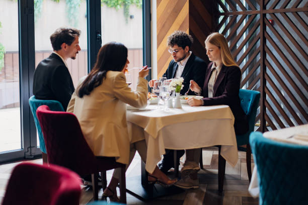 istock A group of entrepreneurs having fun during a business lunch in a restaurant 1479641027