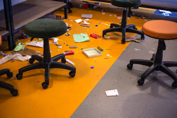 mess, messy classroom with chairs, scattered stuff, disorder and interior concept