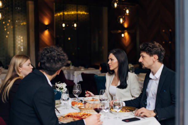 istock Positive people enjoying pizza, spaghetti and wine in a restaurant 1479641482