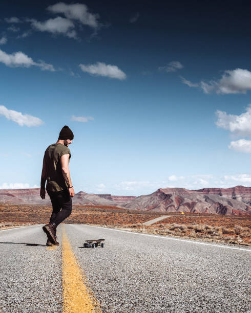 istock man using the skateboard in the monument valley 1479641497