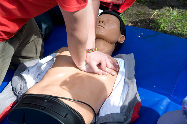 istock Training to performance of artificial breath on a dummy. 147964232