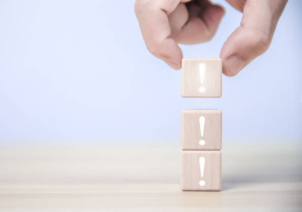istock Place a wooden block showing an exclamation mark. Error warning, notification, maintenance 1479643194