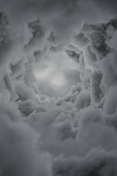 istock 3D rendering of grey cloud tunnel with round hole 1479646134